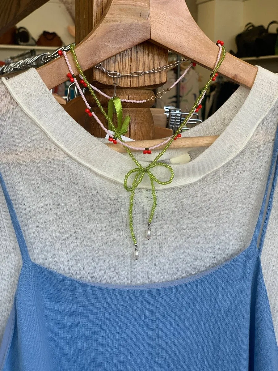 LILOU Gems Beaded Bow Necklace (Various Colours)